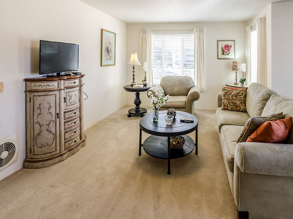A cozy living room with comfortable seating and tasteful decor.