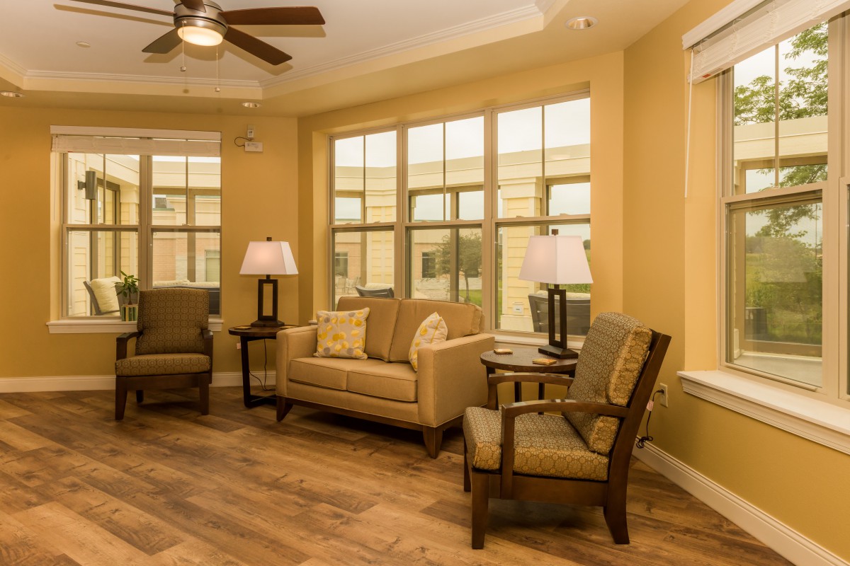 A cozy living room with comfortable seating and warm lighting.