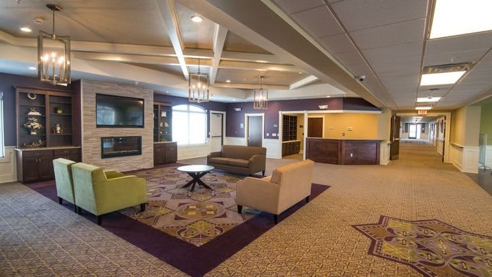 A modern lobby featuring comfortable seating and stylish decor.