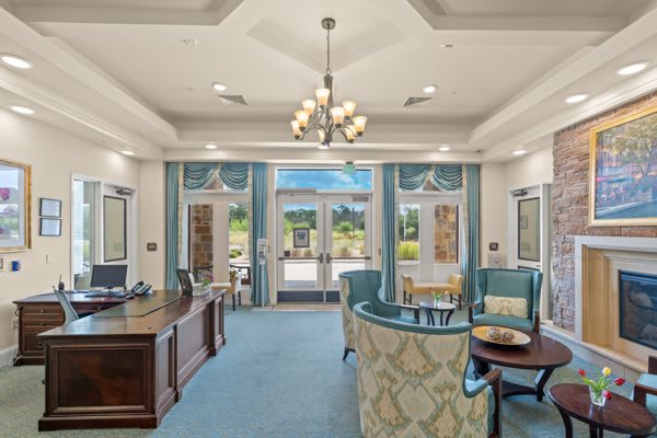 A bright and welcoming lobby with a reception desk and comfortable seating.
