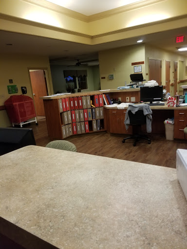 Interior view of a hospital reception area and workstation.