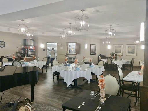 A beautifully arranged dining area featuring elegant tables and tasteful lighting.