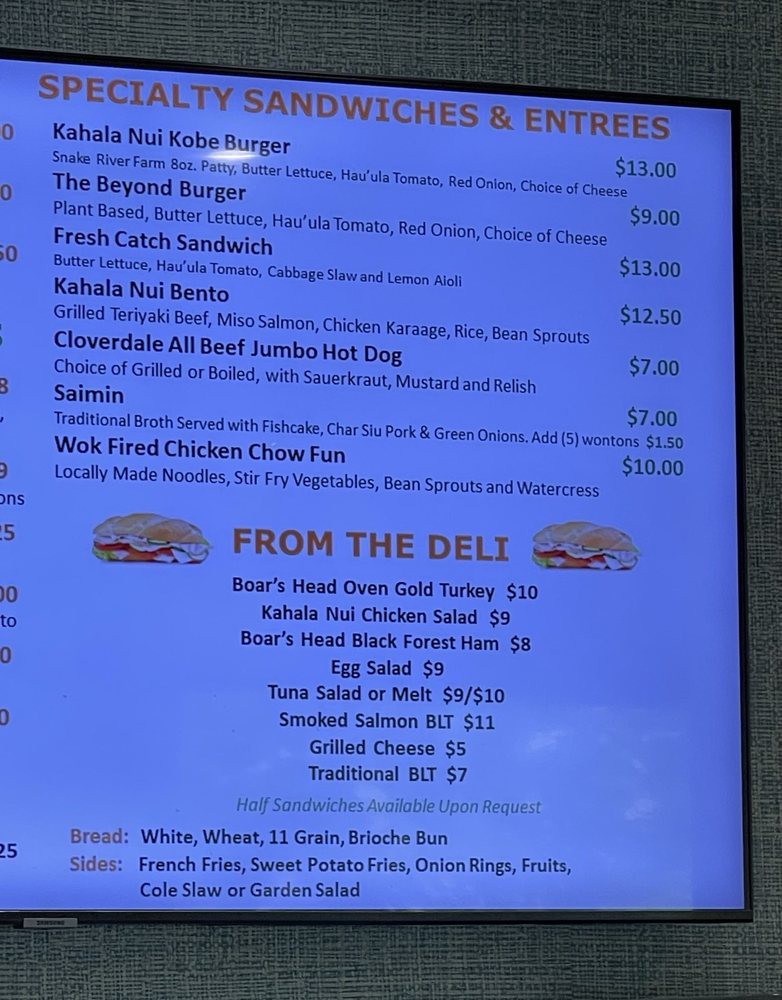A menu displaying a variety of sandwiches and deli items with prices.