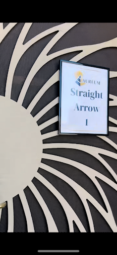 A decorative sign labeled 'Straight Arrow 1' set against a stylized sun-like background.