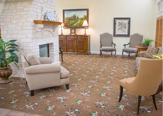 A cozy living room featuring comfortable seating, a fireplace, and elegant decor.