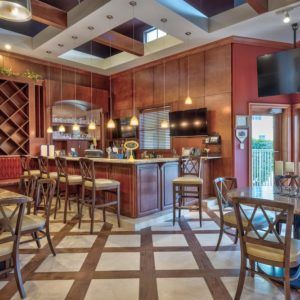 A cozy bar and restaurant interior with stylish seating and warm lighting.