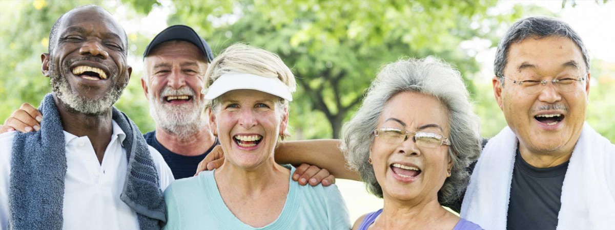 A group of happy senior friends enjoying time outdoors.
