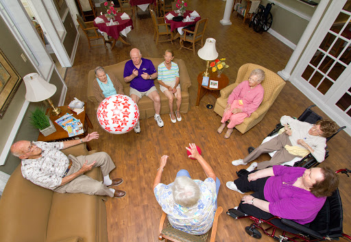 Seniors engaged in a lively group activity at a community center.