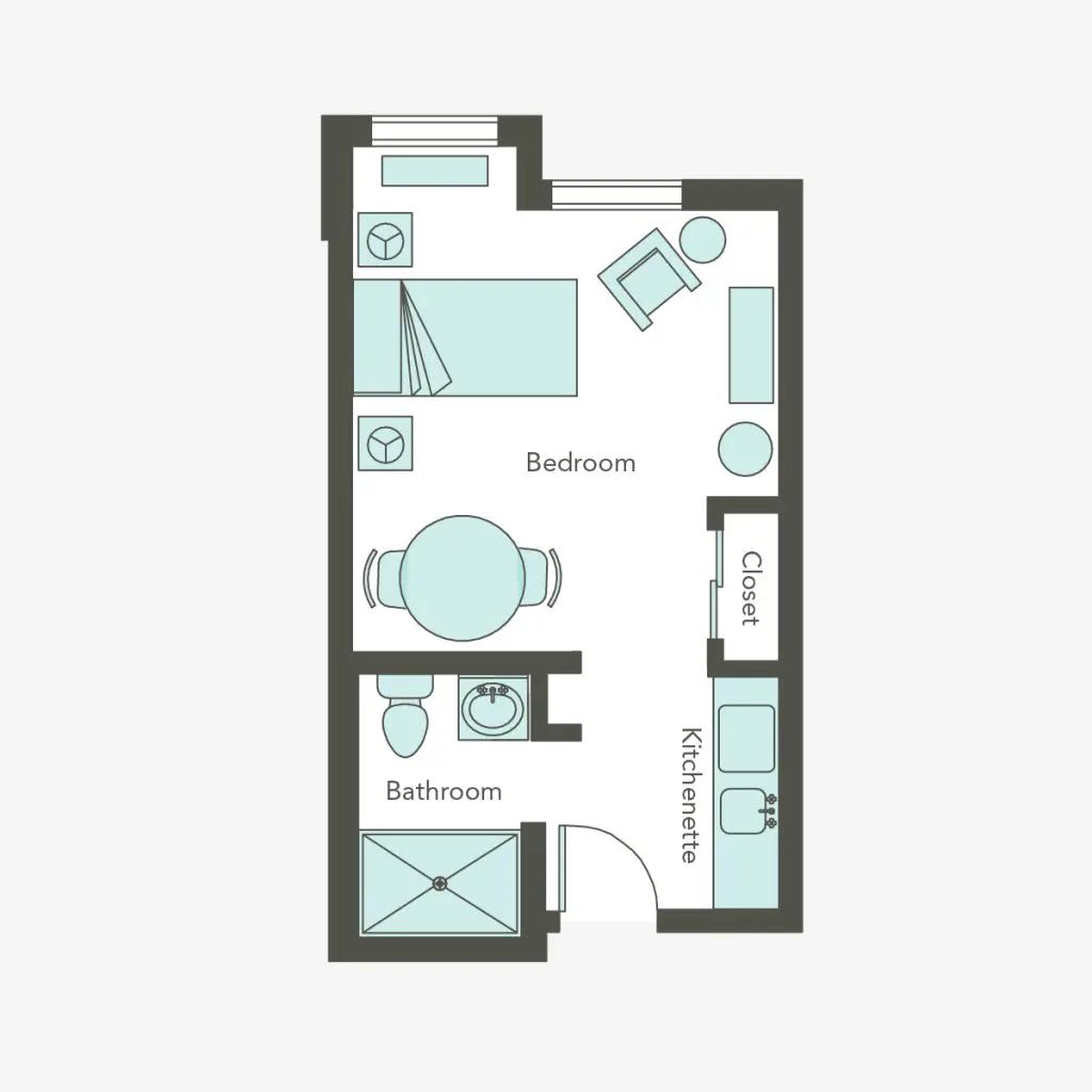 A floor plan of a studio apartment featuring a bedroom, bathroom, and kitchen area.