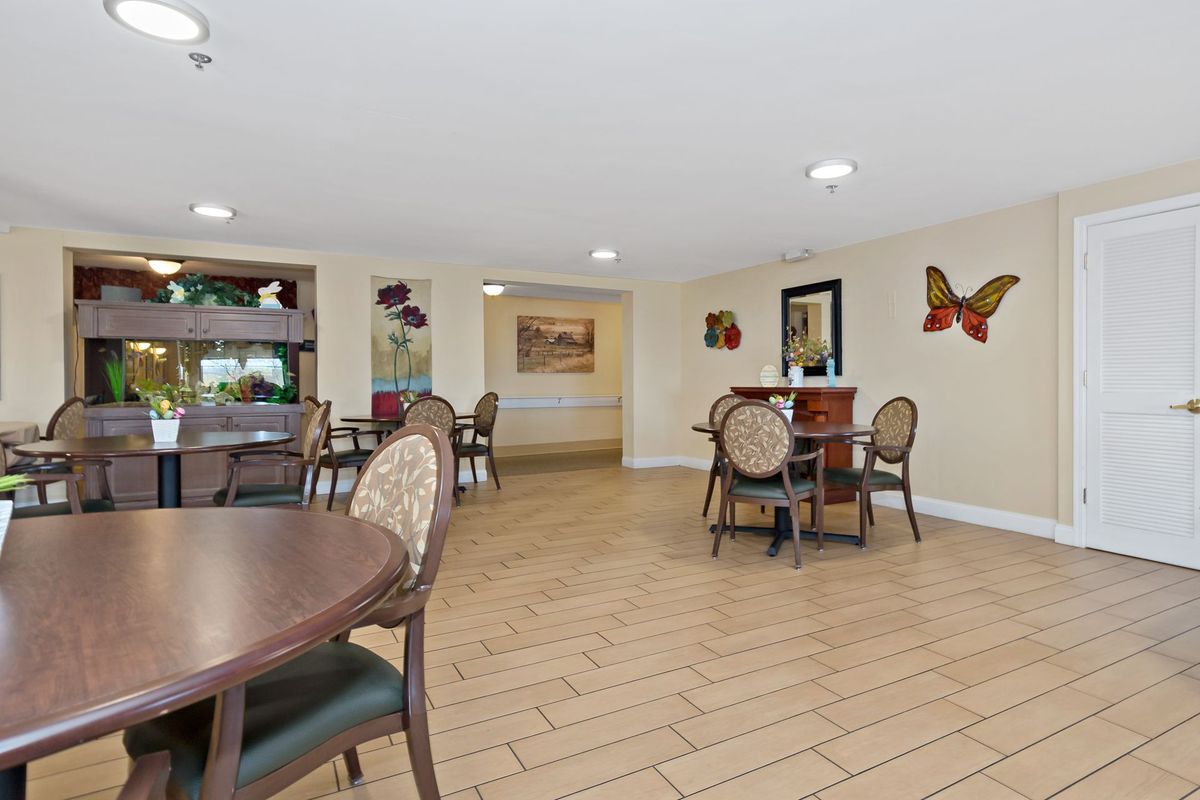 Spacious dining area with neatly arranged tables and chairs.