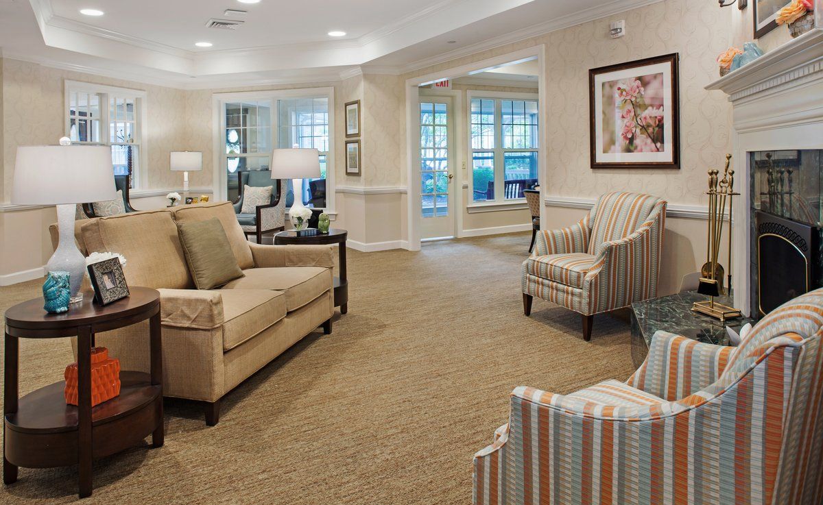A cozy living room with comfortable seating and warm lighting.