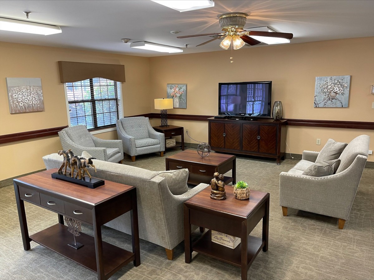 A cozy living room with comfortable seating and a television.