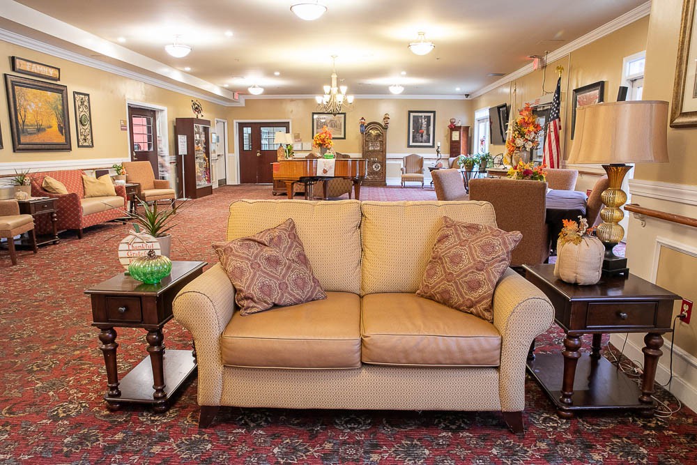 A warm and inviting living room with comfortable seating and elegant decor.