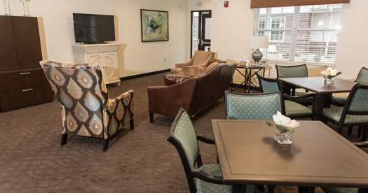 A cozy living room with comfortable seating and a television.