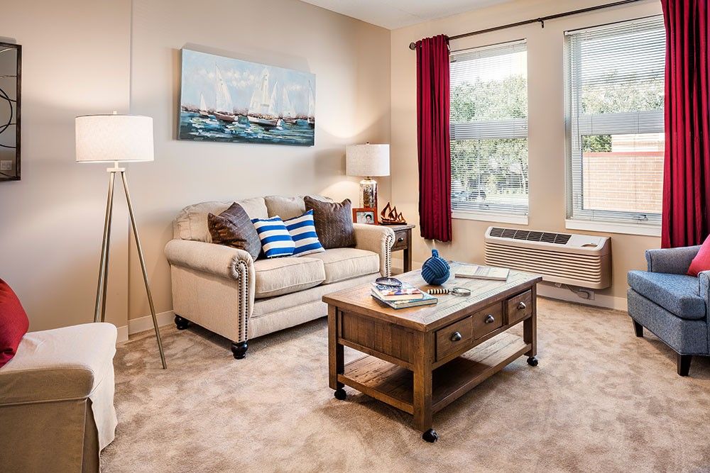 A cozy living room with a comfortable sofa, coffee table, and elegant decor.