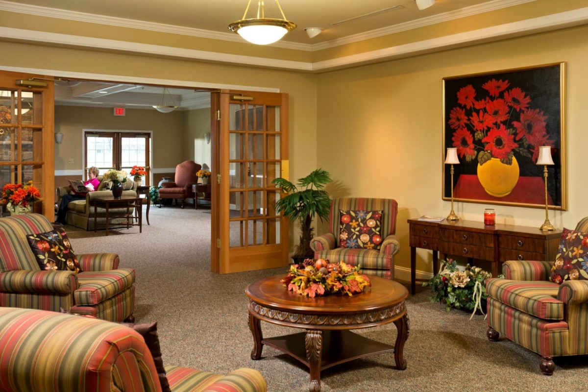 A cozy living room with elegant furniture and vibrant decorative elements.