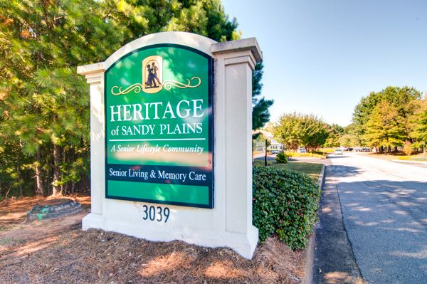 Entrance sign for Heritage of Sandy Plains senior living and memory care facility.