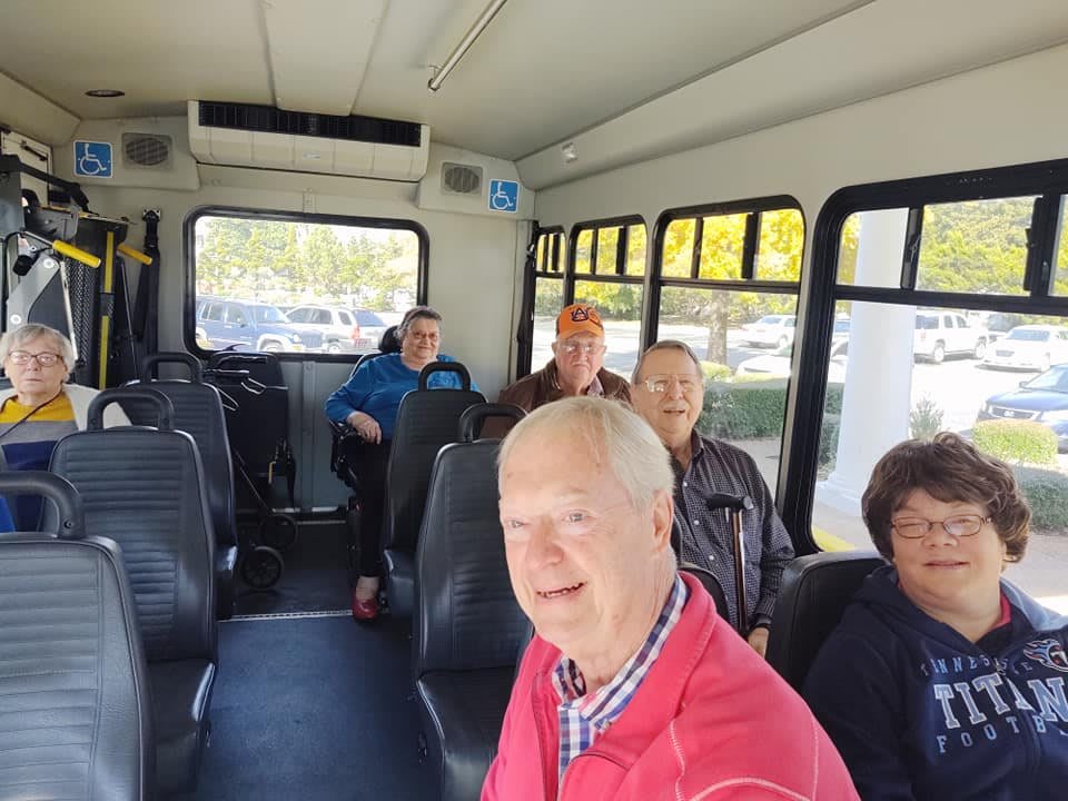 A group of people seated inside a bus.