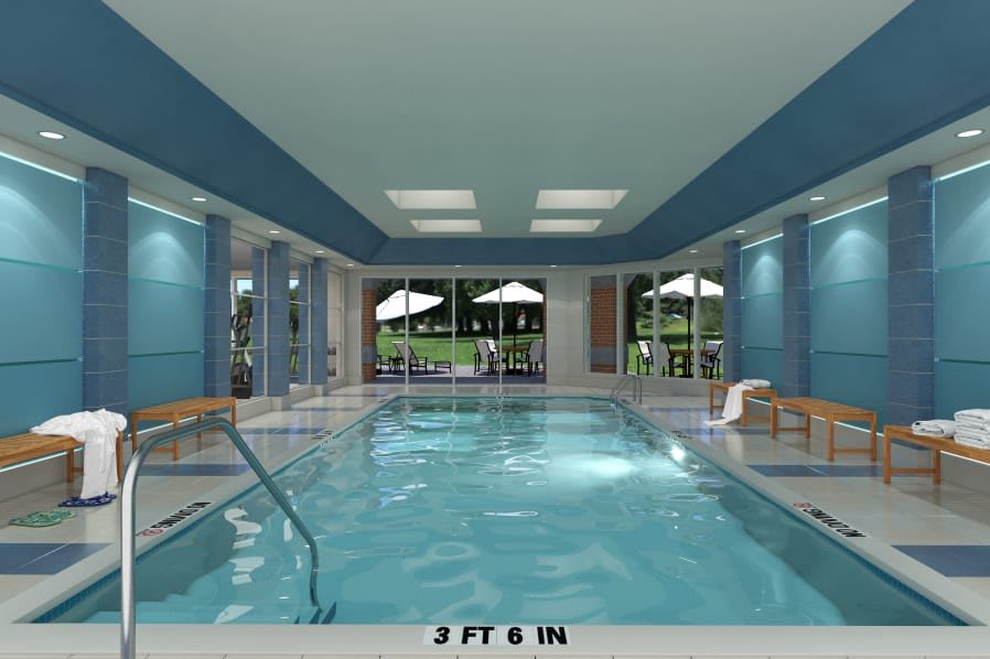 A serene indoor swimming pool with natural lighting and elegant design.