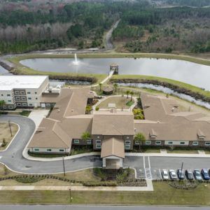 Aerial view of a complex with surrounding ponds and roads.
