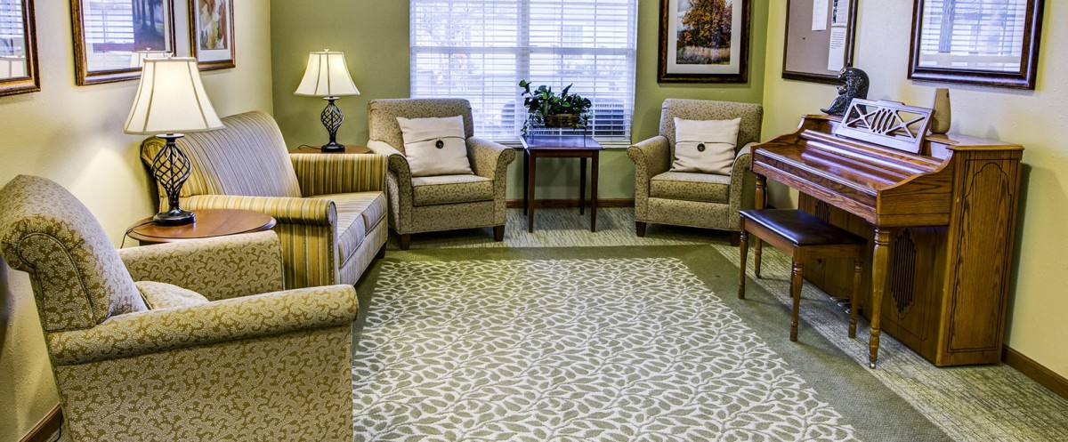 A cozy living room with comfortable seating and elegant decor.