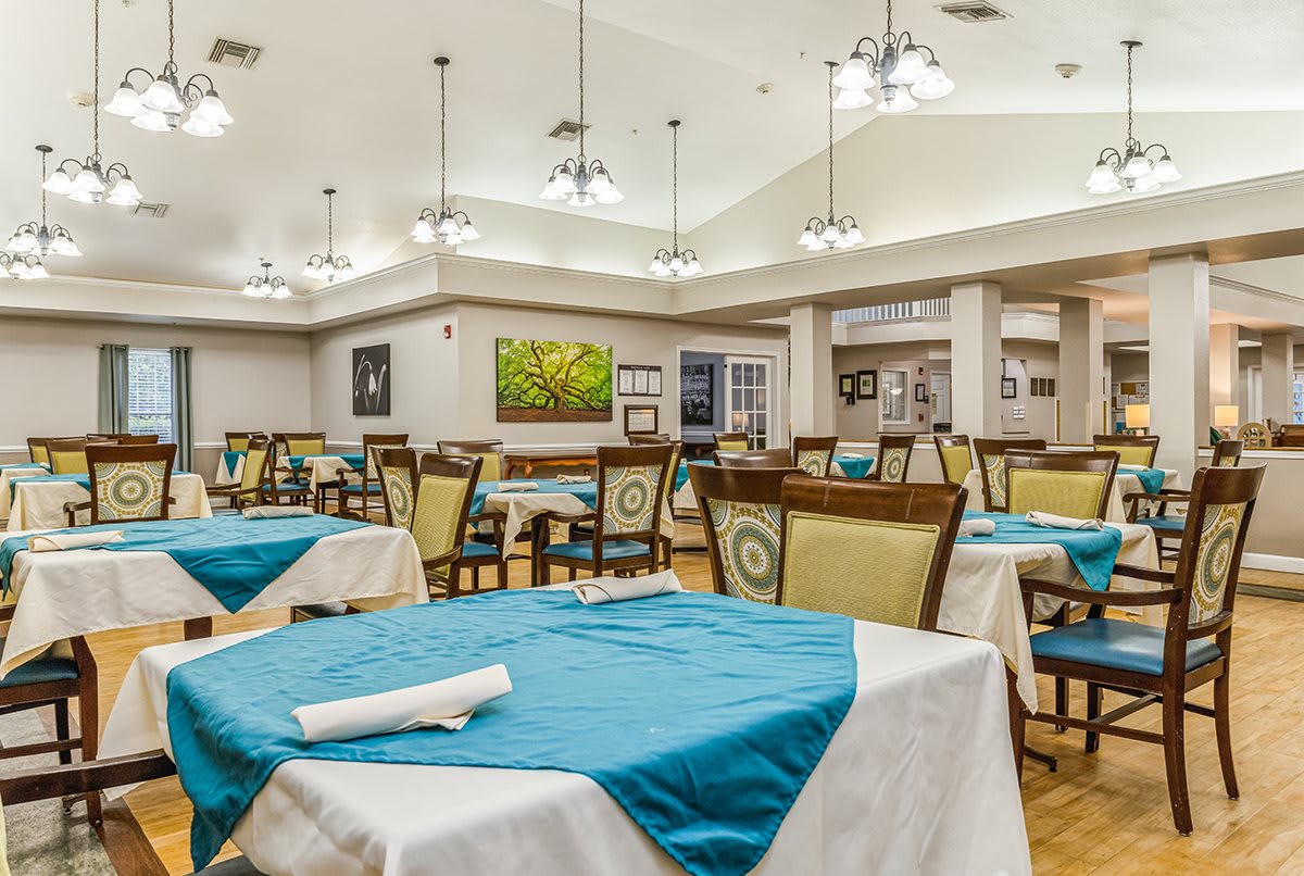 Spacious dining area with neatly arranged tables and elegant decor.