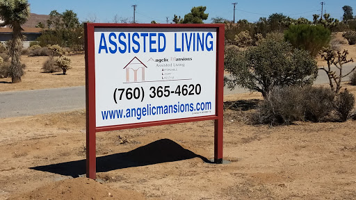 A sign for an assisted living facility providing contact information and a website.