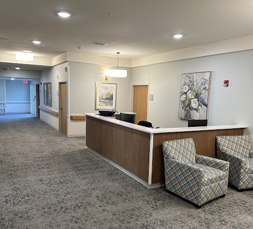 A welcoming reception area featuring comfortable seating and decorative wall art.