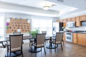 A modern kitchen and dining area with natural lighting.