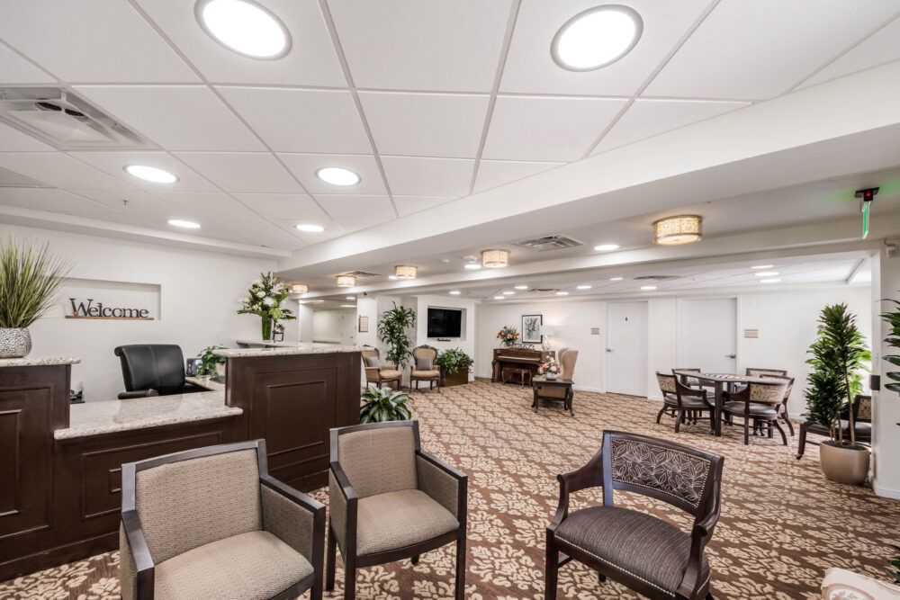 A well-lit lobby with comfortable seating and a reception desk.