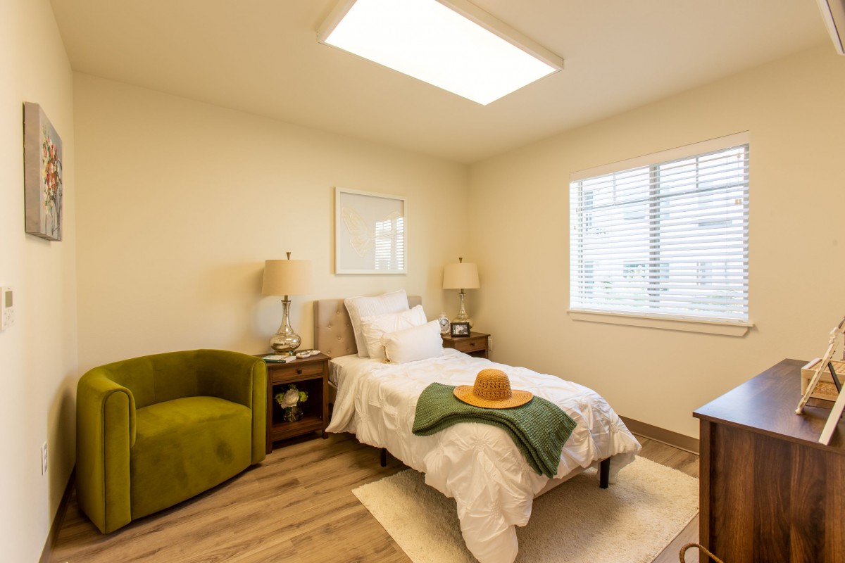 A cozy modern bedroom with a single bed and stylish decor.