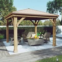 A cozy outdoor gazebo with seating and a table.