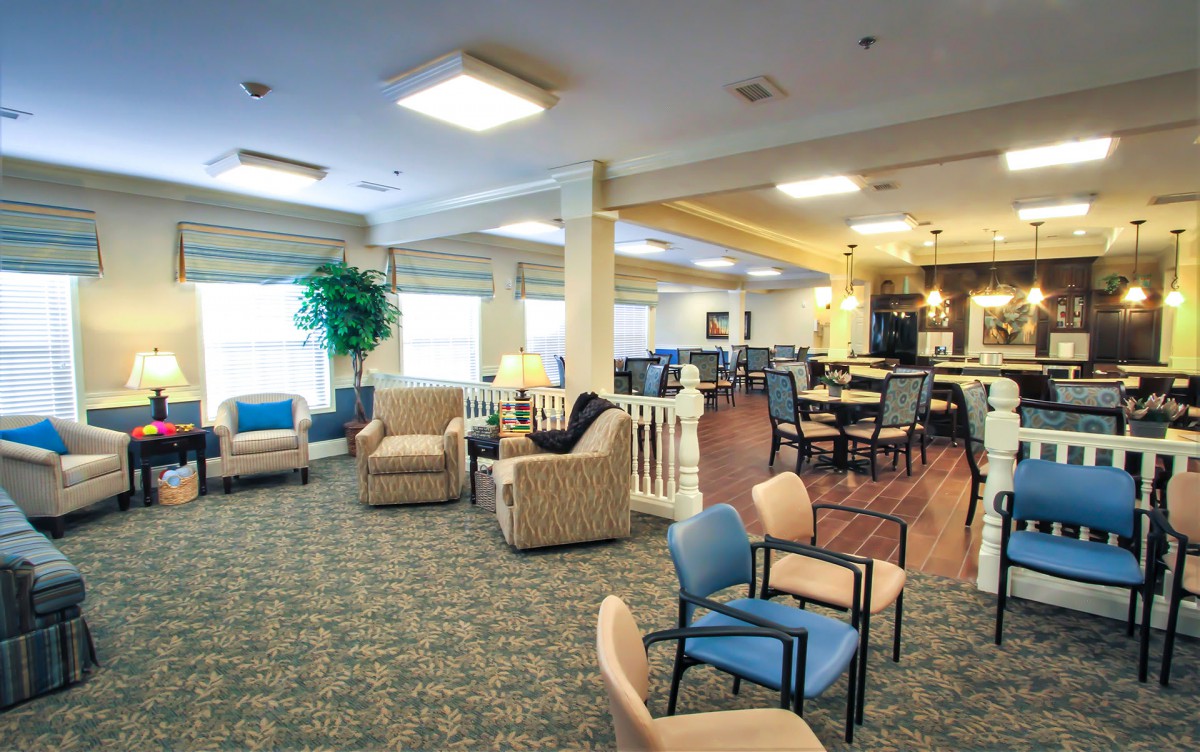 A spacious lounge area with comfortable seating and ample lighting.