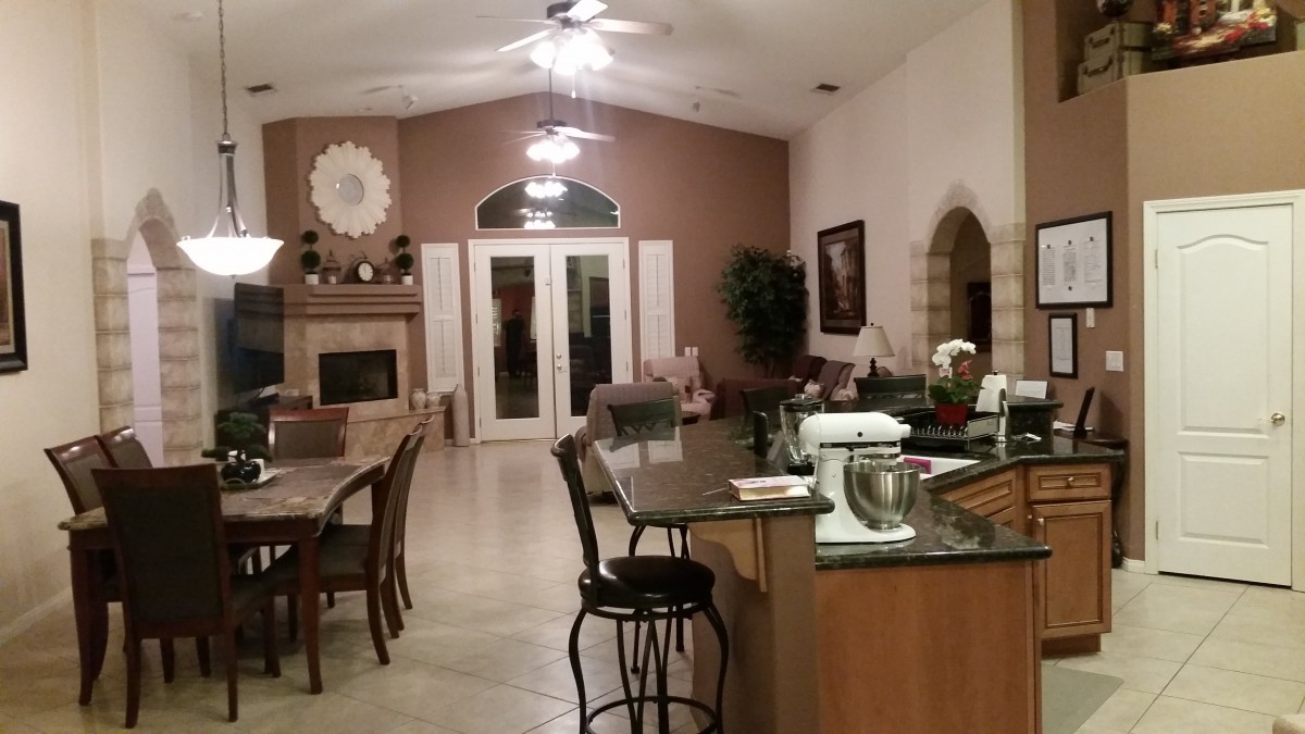 Spacious open-concept living area with a modern kitchen and dining setup.