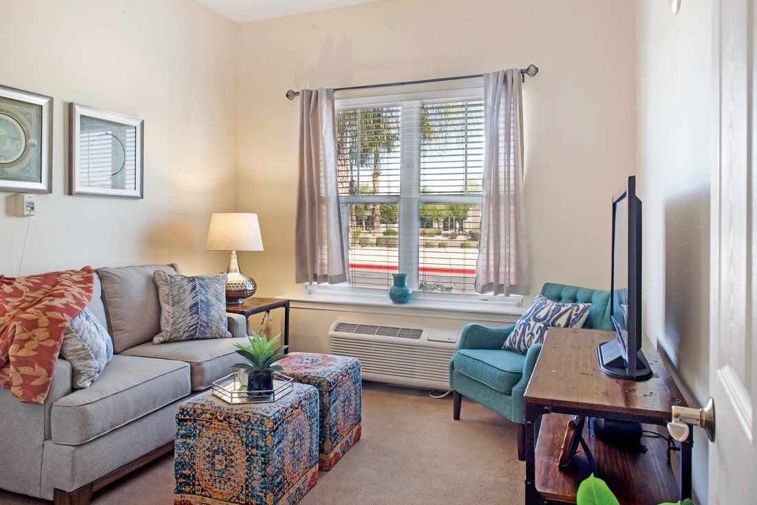 A cozy living room with comfortable seating and tasteful decor.