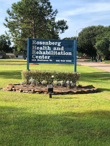 Sign for Rosenberg Health and Rehabilitation Center surrounded by landscaped area.