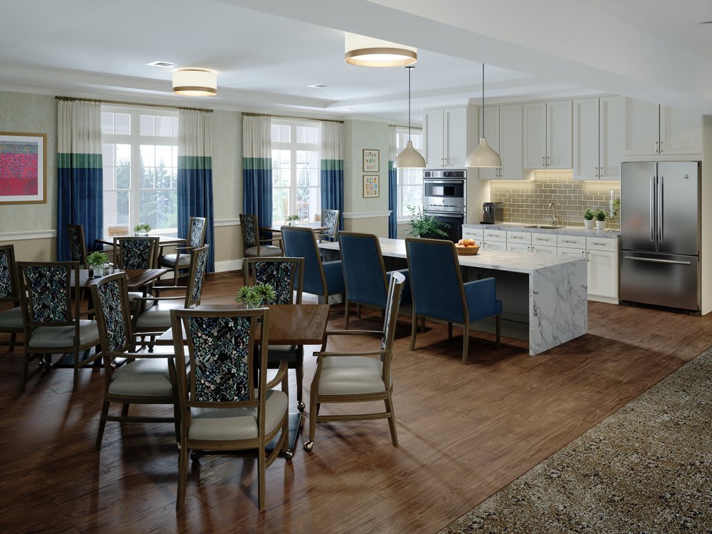 A modern kitchen and dining area with an island counter and elegant seating.