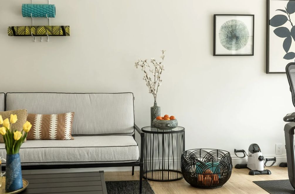 A modern minimalist living room with a gray sofa, stylish coffee table, and elegant wall art.