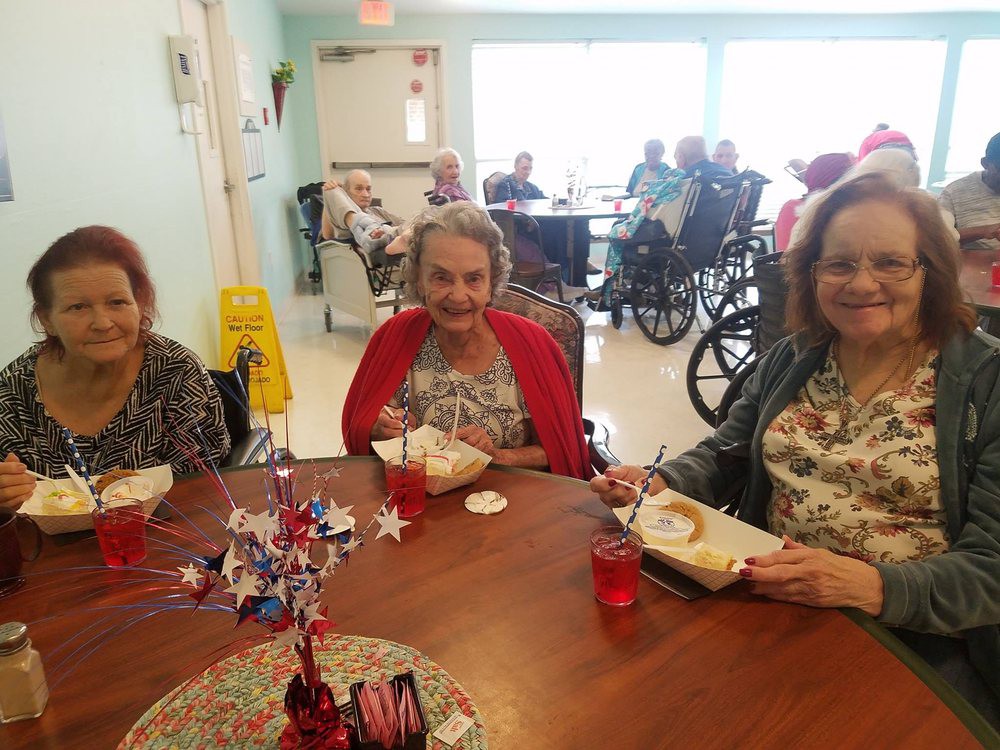 A group of seniors enjoying a meal together at a community gathering.