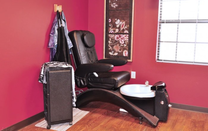 A relaxing pedicure chair setup in a nail salon with a stylish interior.
