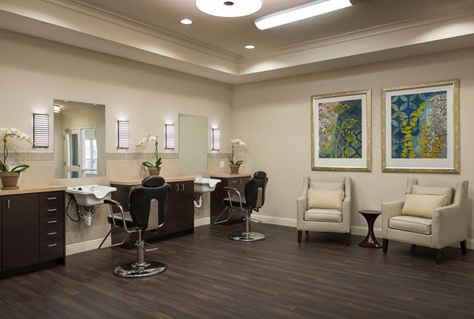 A modern and stylish salon interior with hairdressing stations and mirrors.