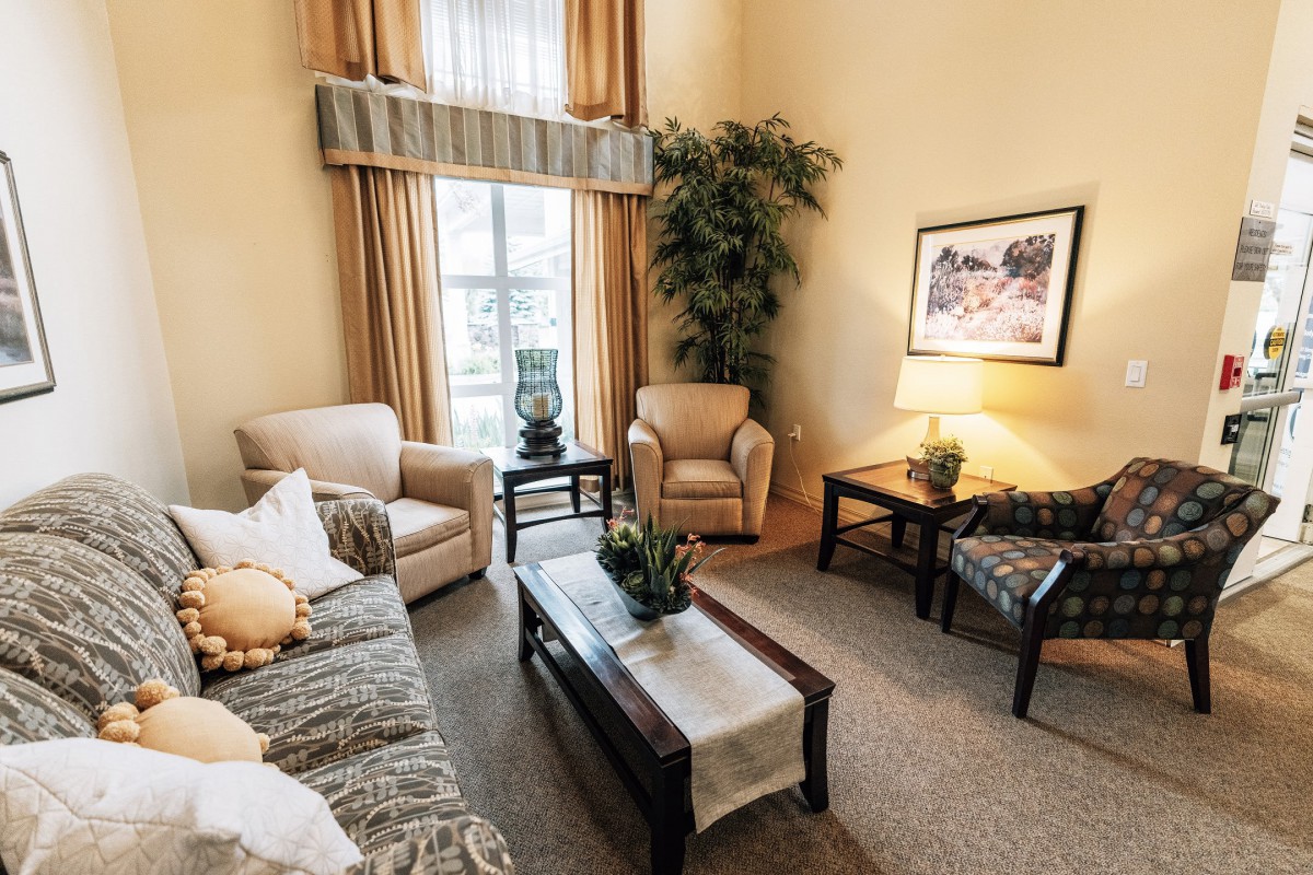 A cozy living room featuring comfortable seating and elegant decor.