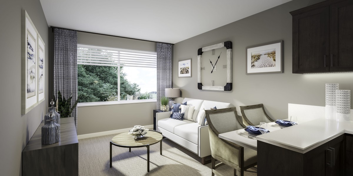 A modern living room with a cozy sofa, wall art, and a dining area by a large window.