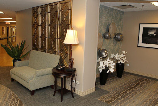 A cozy and elegantly decorated living room corner featuring stylish furniture and decorative elements.