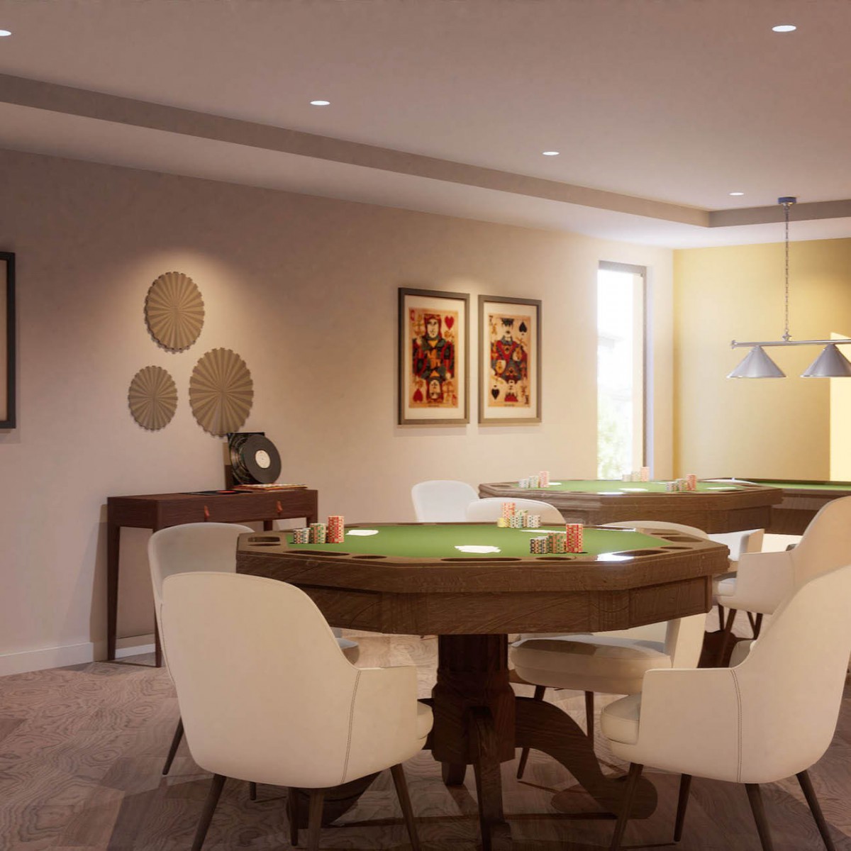 A stylish game room featuring a poker table with surrounding chairs, elegant wall decor, and framed artwork.