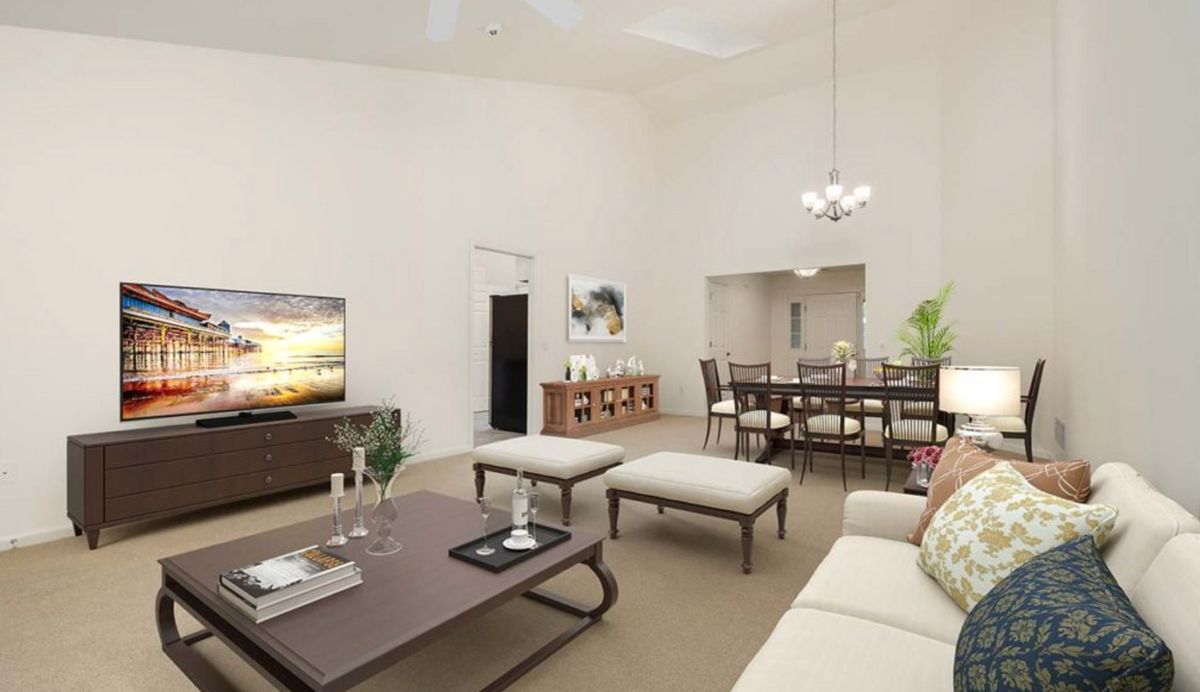 A modern living and dining area with elegant furniture and decor.
