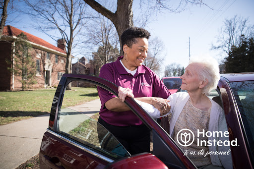 A caregiver helps a senior woman out of a car, showcasing the importance of support and companionship.