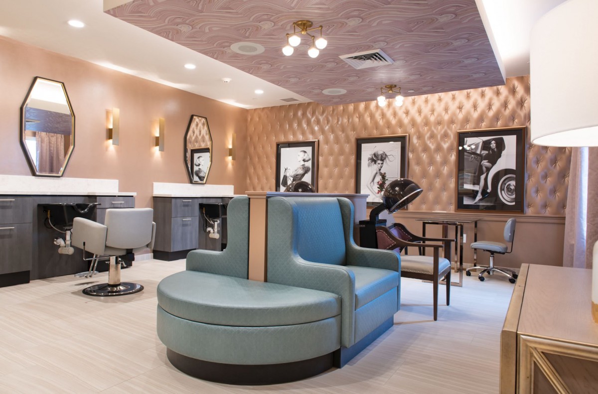 A modern salon interior with stylish seating and elegant decor.