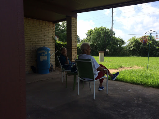 Two individuals enjoying a peaceful moment outdoors on a sunny day.