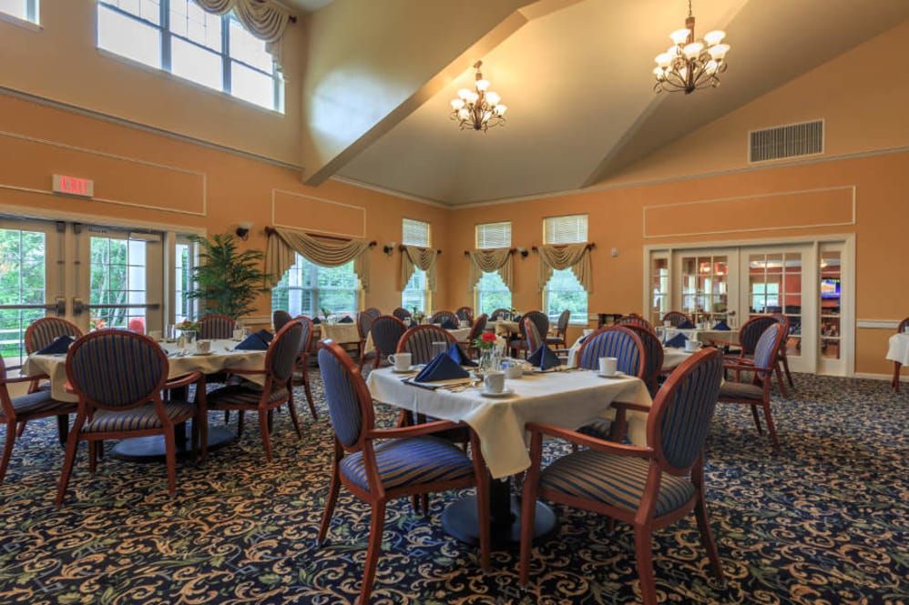 Elegant dining room with neatly arranged tables and classic decor.
